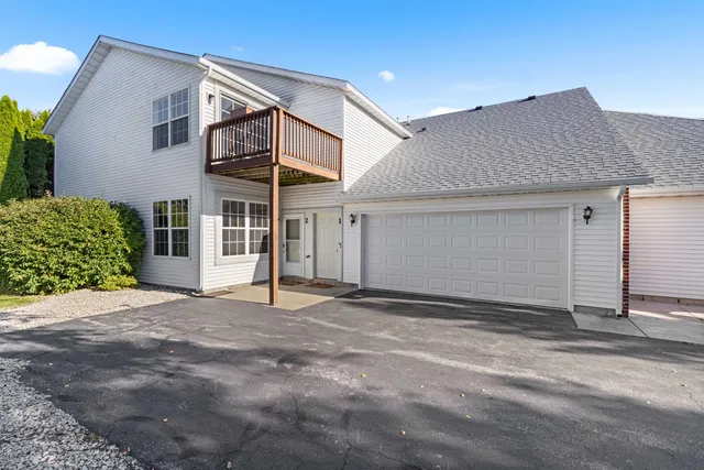 a front view of a house with a garage