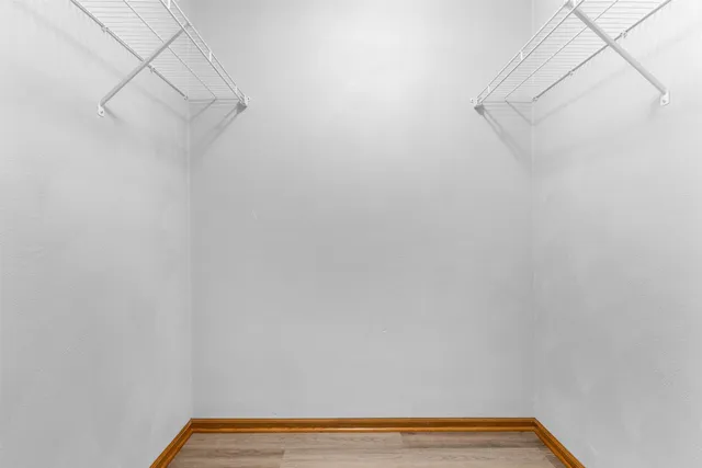 a view of a small space with racks on the wall