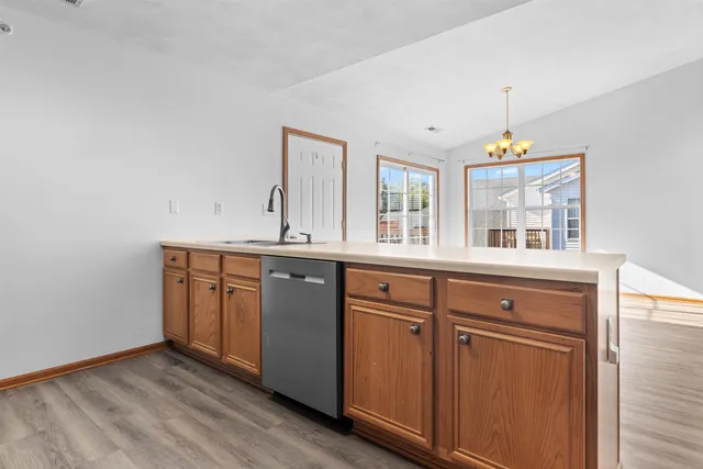 a kitchen with a sink and a window
