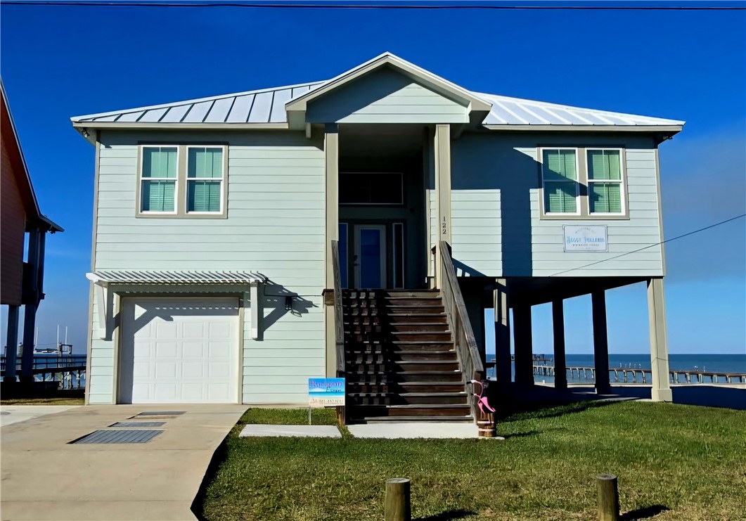 122 Ridge Harbor Drive Rockport, TX 78382 - Photo 2 of 34 a front view of a house with a yard