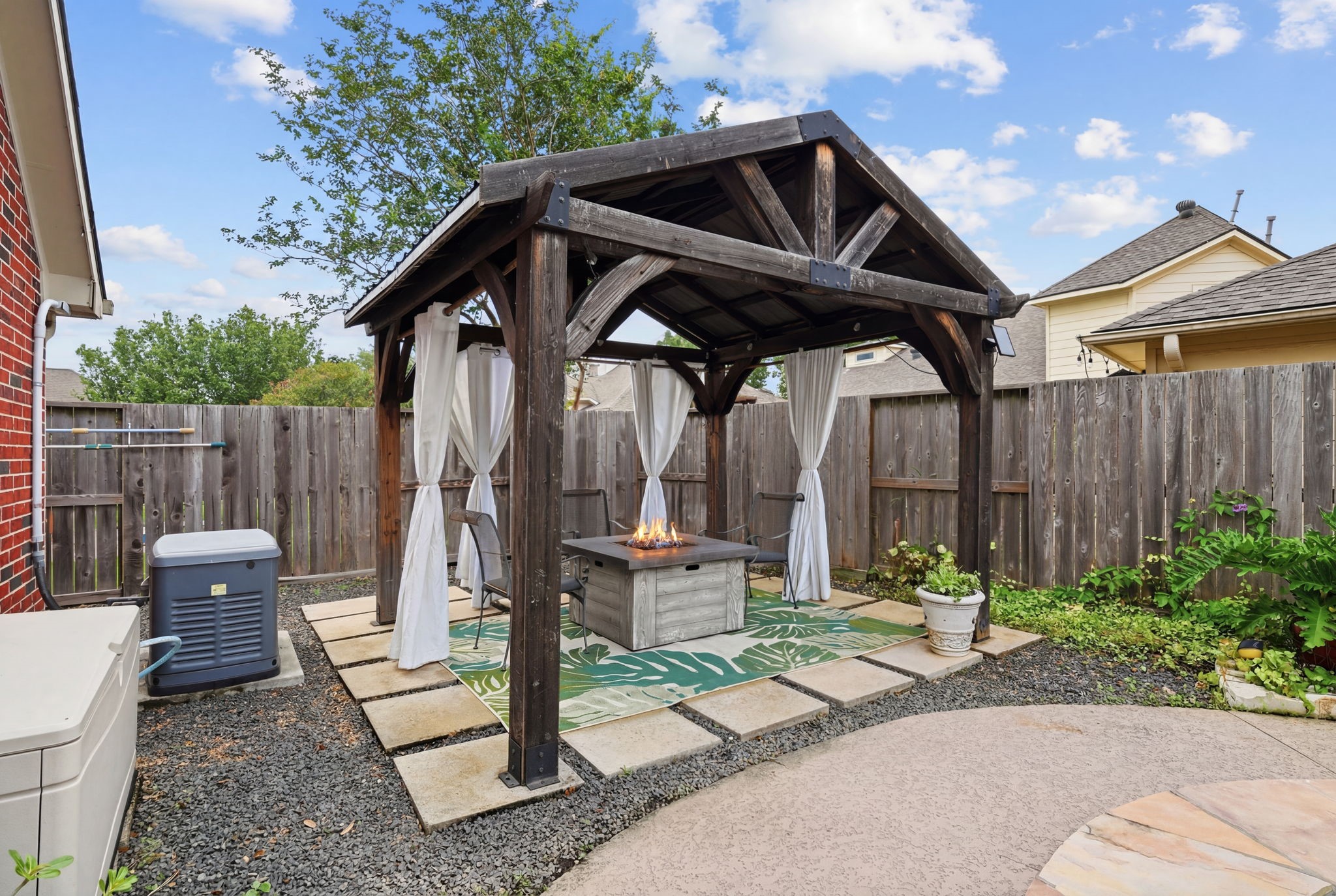 1010 Bringewood Chase Drive Spring, TX 77379 - Photo 41 of 49 Pergola with fire pit. Pool heater and generator