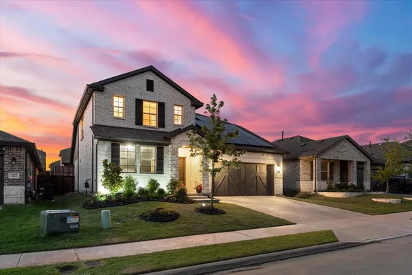 a front view of a house with yard