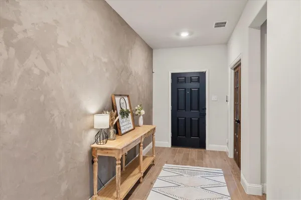 a reading room with furniture and a window