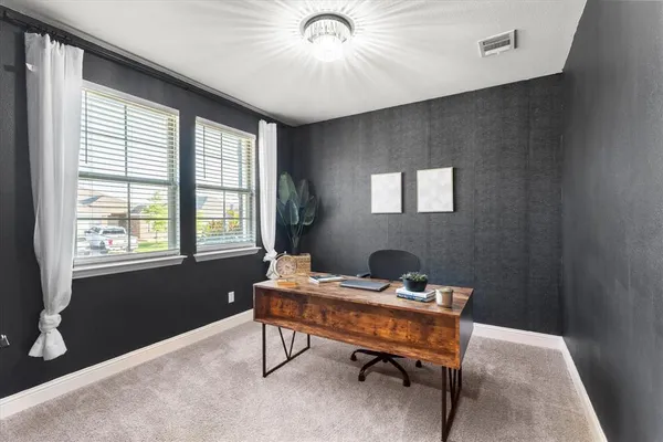 a workspace with furniture and a window