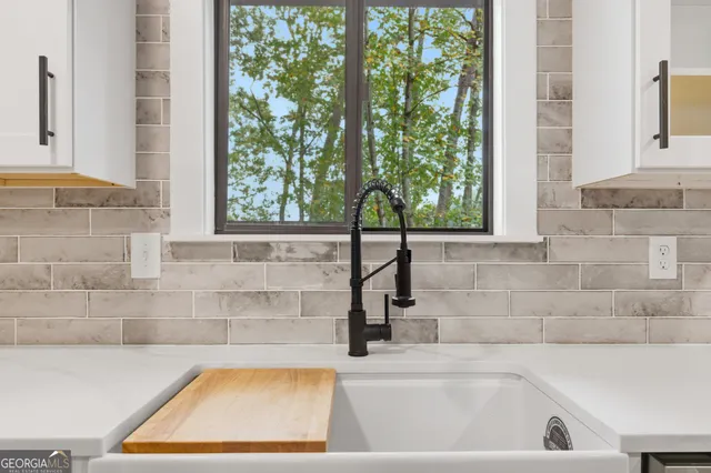 a view of a room with wooden floor and window