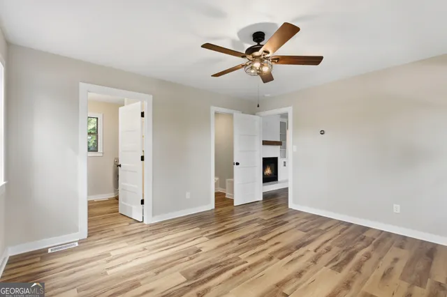 a bathroom with a double vanity sink a mirror and a toilet