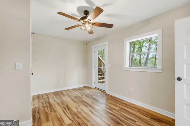 a bathroom with a sink a toilet and a window