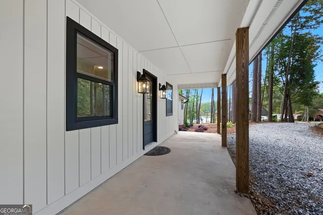 a view of living room and kitchen with wooden floor
