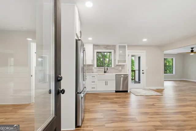 a kitchen with a stove sink and refrigerator