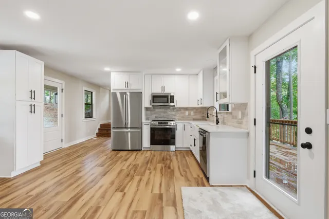 a bathroom with a bathtub and window