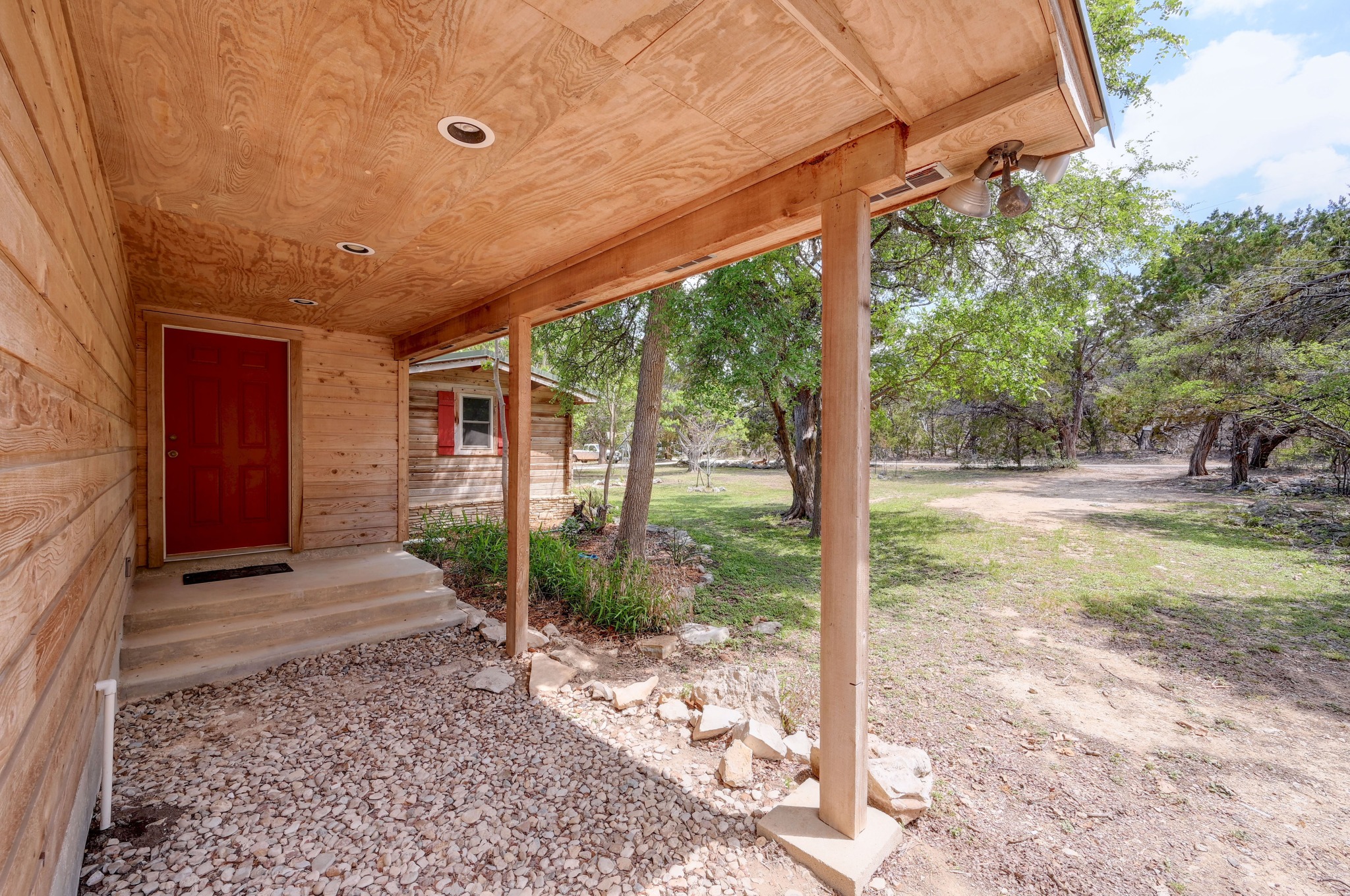 900 Box Canyon Road Wimberley, TX 78676 - Photo 38 of 40 Side entrance that leads to the workshop and pole barn.
