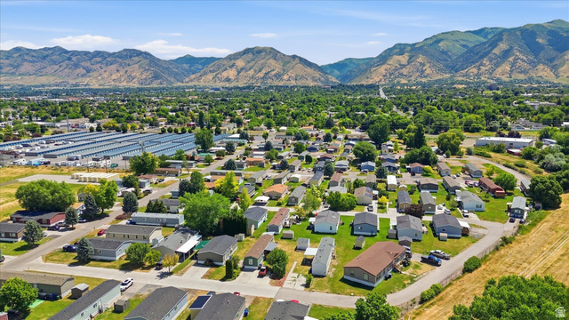 433 North 750 West Logan, UT 84321 - Photo 34 of 40 Expansive community featuring numerous manufactured homes on individual lots, surrounded by mature trees