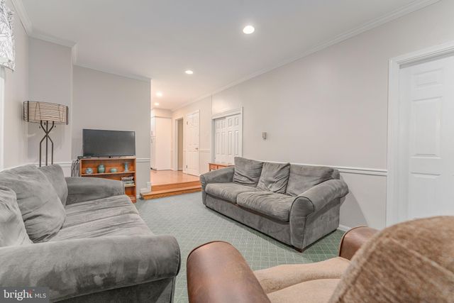 a spacious bedroom with a bed and a table in it