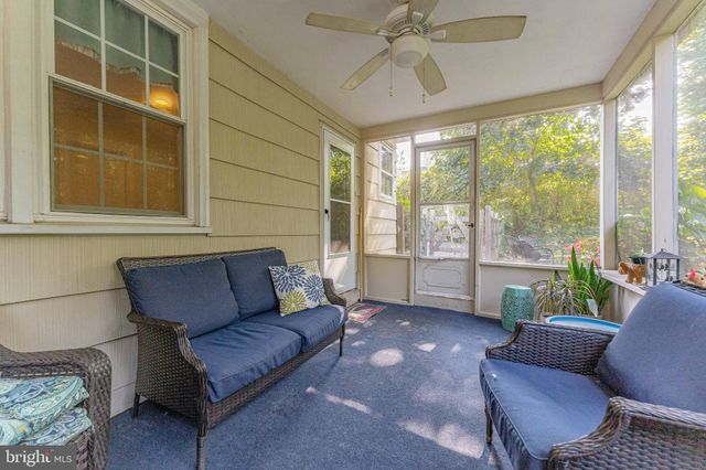 an empty room with furniture and a window