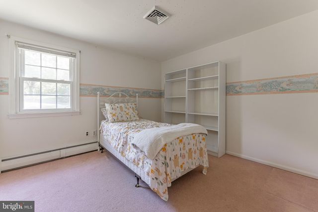 a house view with swimming pool in front of it