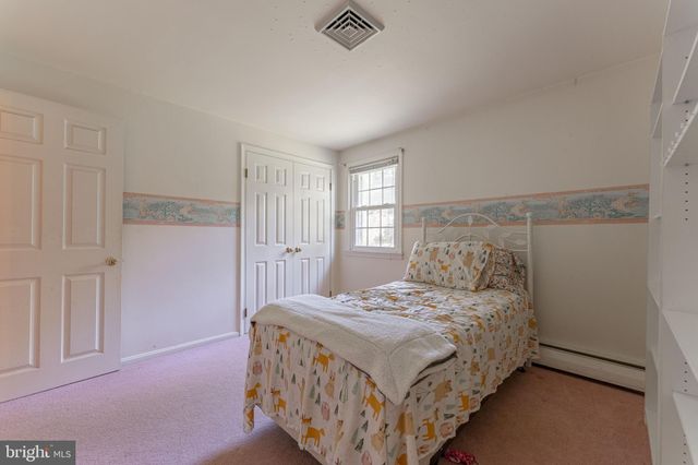 an aerial view of a house with swimming pool and garden view