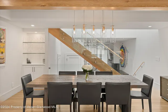 a view of a dining room with furniture and wooden floor