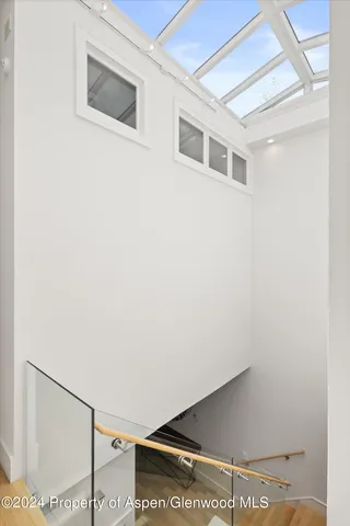 a bed sitting in a bedroom with a lamp