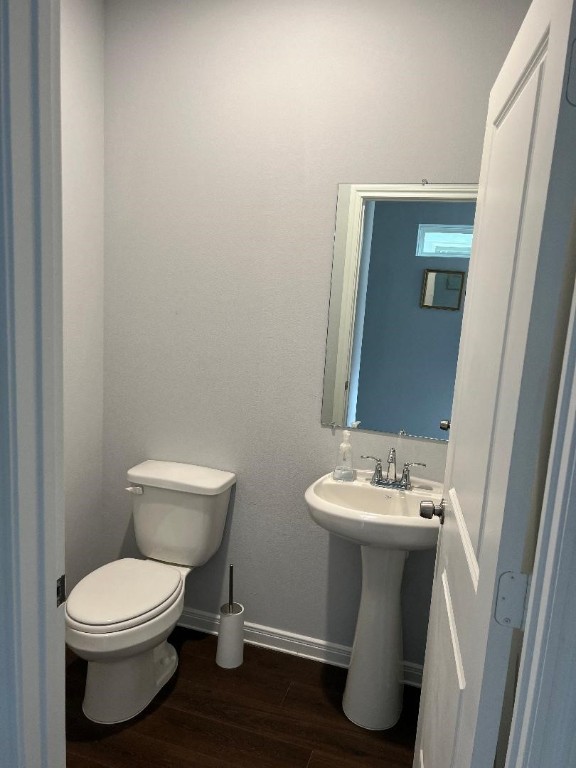 18817 Luminescent Ln Spring Spring, TX 77379 - Photo 4 of 15 a white toilet sitting next to a bathroom sink