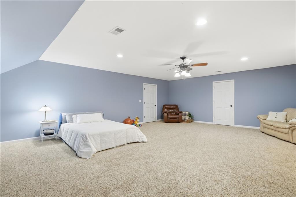 310 Gaines Road Southeast Dalton, GA 30721 - Photo 33 of 53 a bedroom with a bed and a chandelier