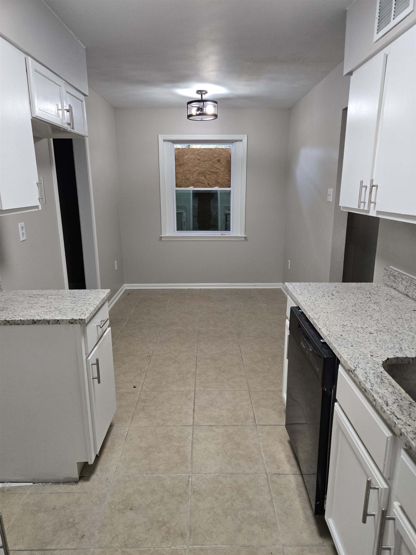 4378 Shadcrest Road Memphis, TN 38128 - Photo 2 of 5 a bathroom with a sink a large mirror and a window