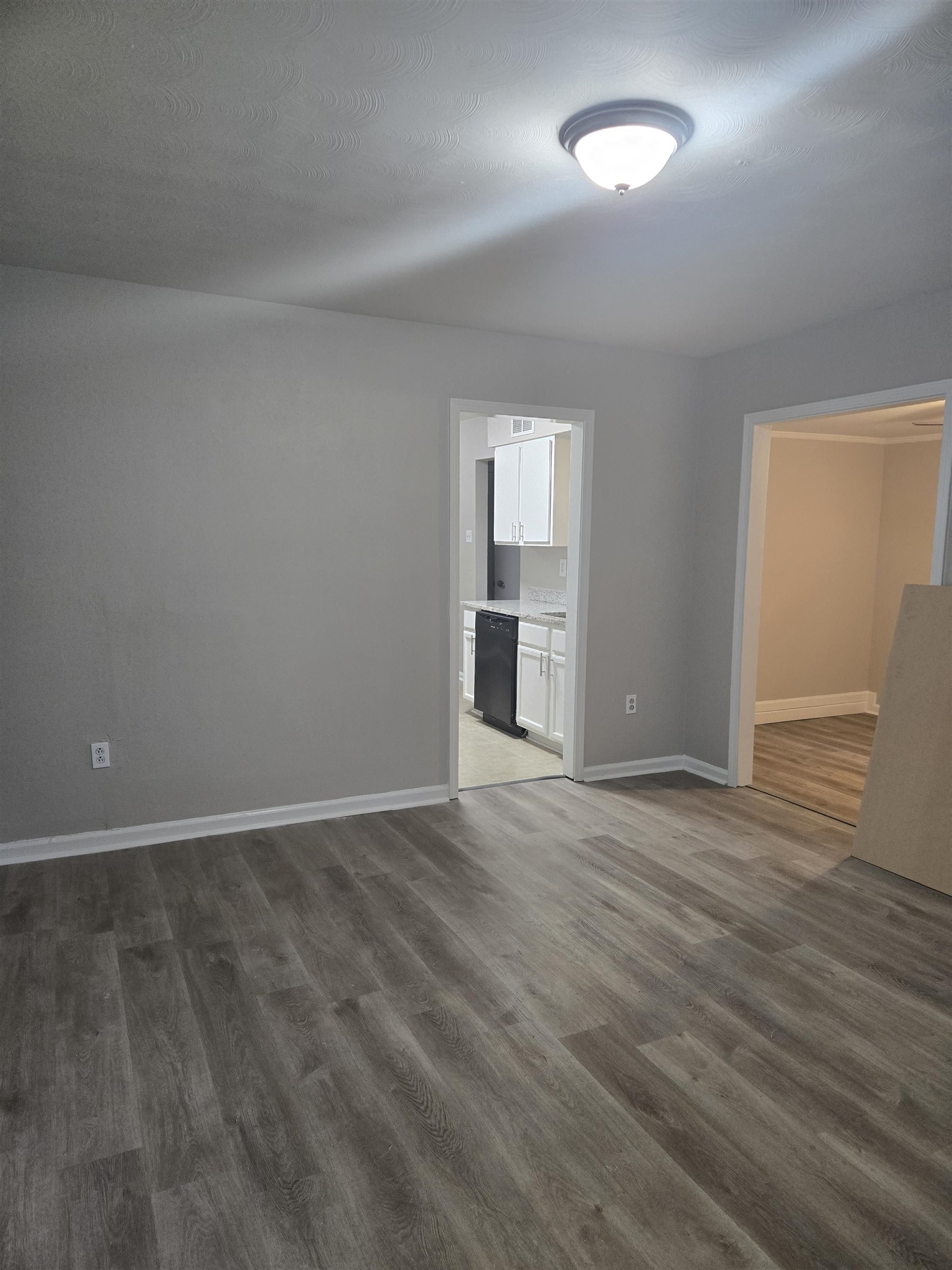 4378 Shadcrest Road Memphis, TN 38128 - Photo 4 of 5 an empty room with wooden floor and windows