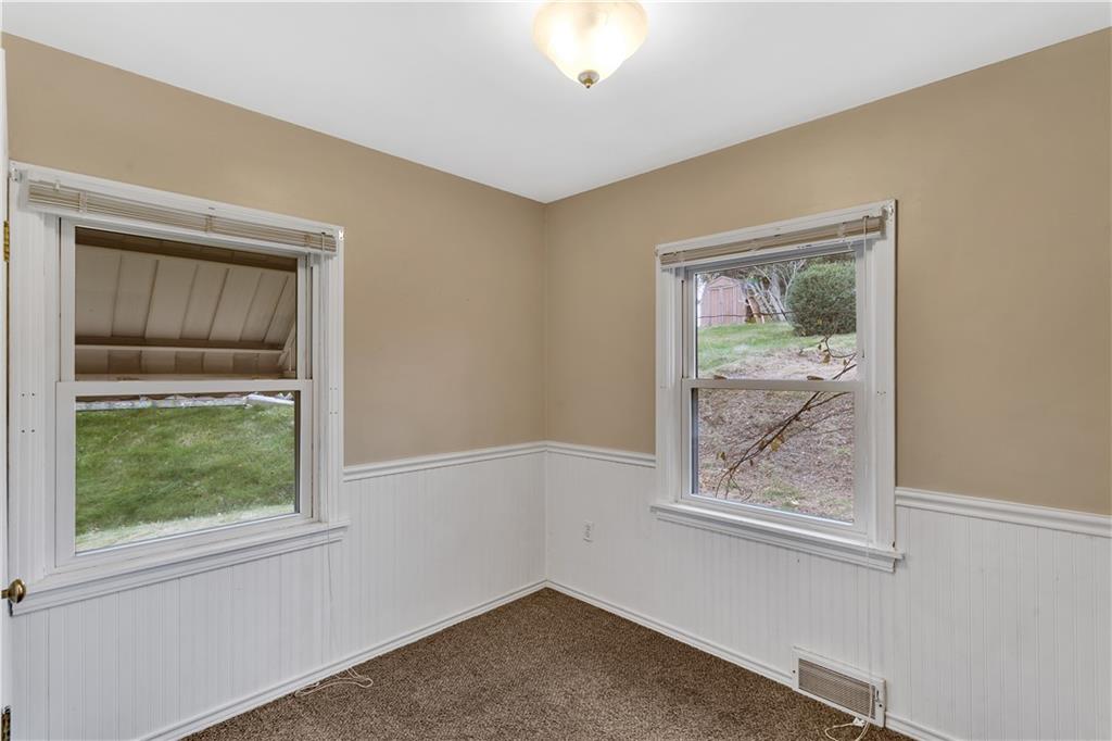1710 Ridge Rd Extension Ambridge, PA 15003 - Photo 17 of 31 an empty room with windows
