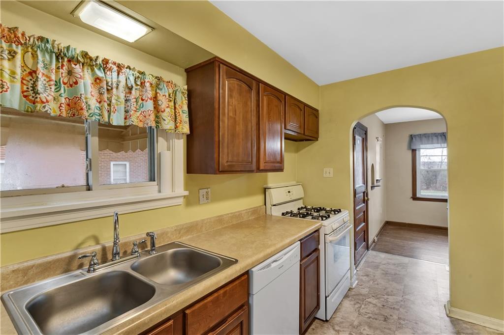 1710 Ridge Rd Extension Ambridge, PA 15003 - Photo 21 of 31 a kitchen with a sink and a refrigerator