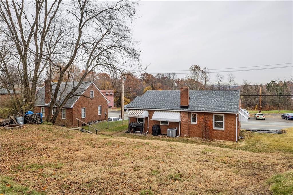 1710 Ridge Rd Extension Ambridge, PA 15003 - Photo 28 of 31 a front view of a house with a yard