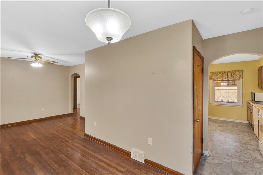 1710 Ridge Rd Extension Ambridge, PA 15003 - Photo 5 of 31 a view of a room with wooden floor and a large window