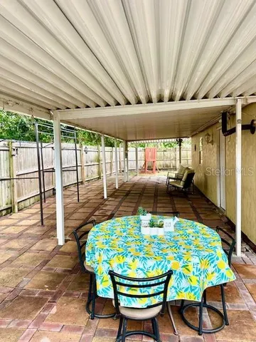 a view of backyard with a swimming pool