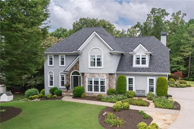 a front view of a house with a yard