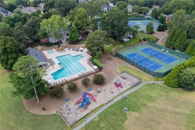 an aerial view of a house with a yard