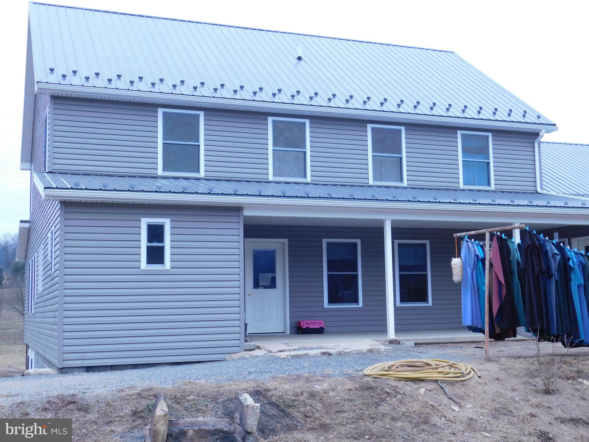 171 Gaul Road Port Royal, PA 17082 - Photo 1 of 46 a view of a house with large windows and a yard