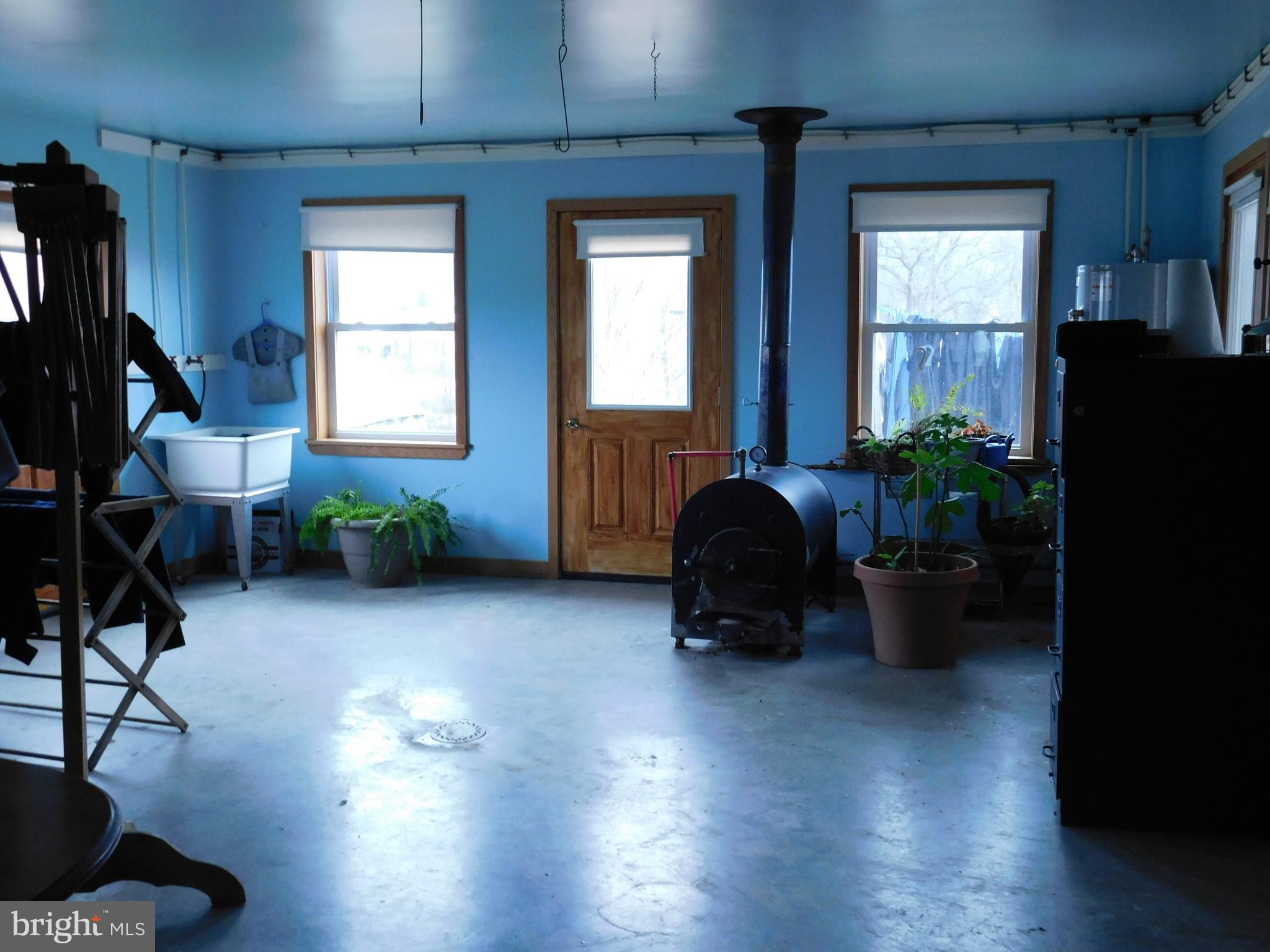 171 Gaul Road Port Royal, PA 17082 - Photo 2 of 46 a living room with furniture and a potted plant