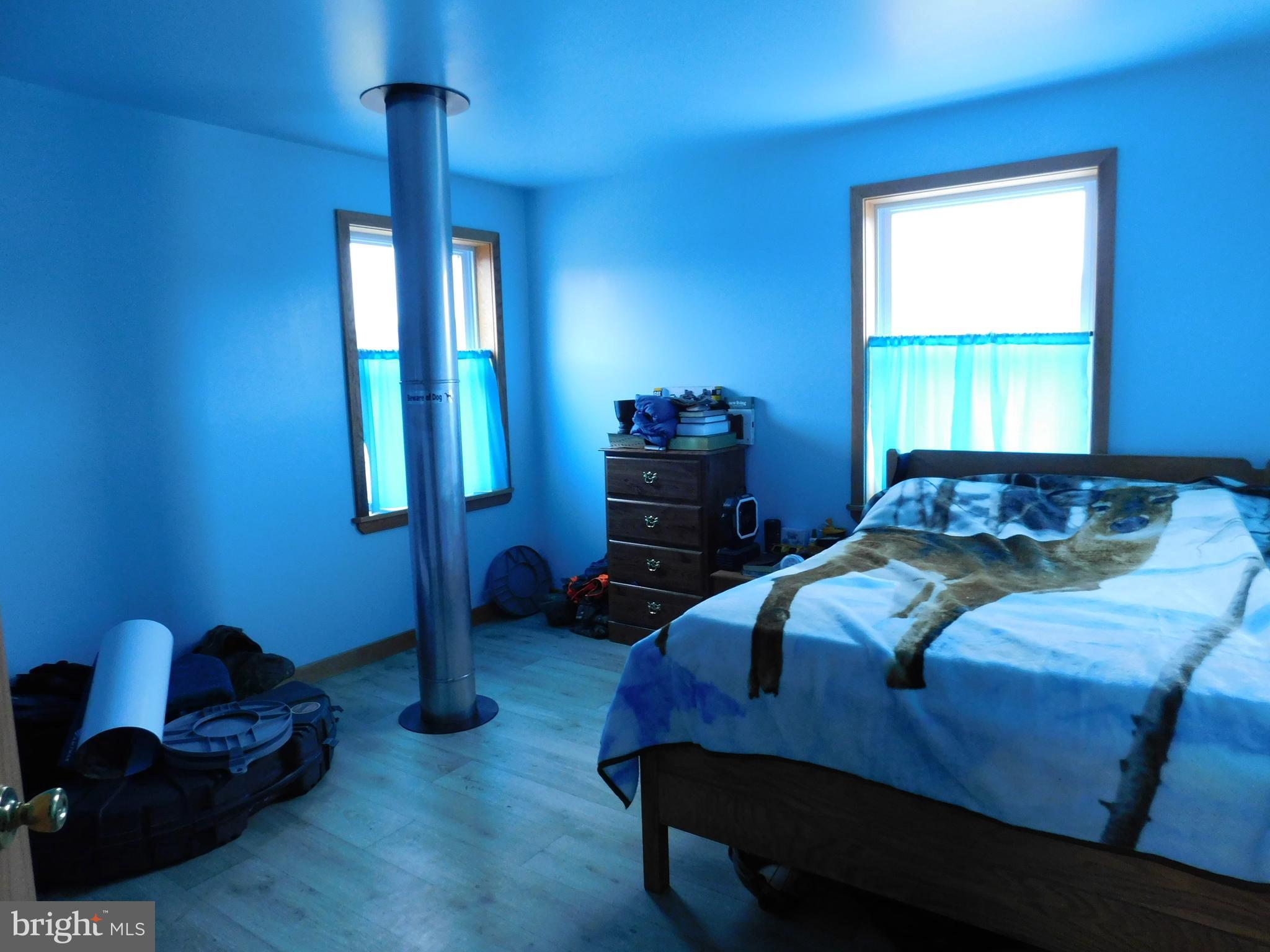 171 Gaul Road Port Royal, PA 17082 - Photo 25 of 46 a bedroom with a bed and a dresser next to a window