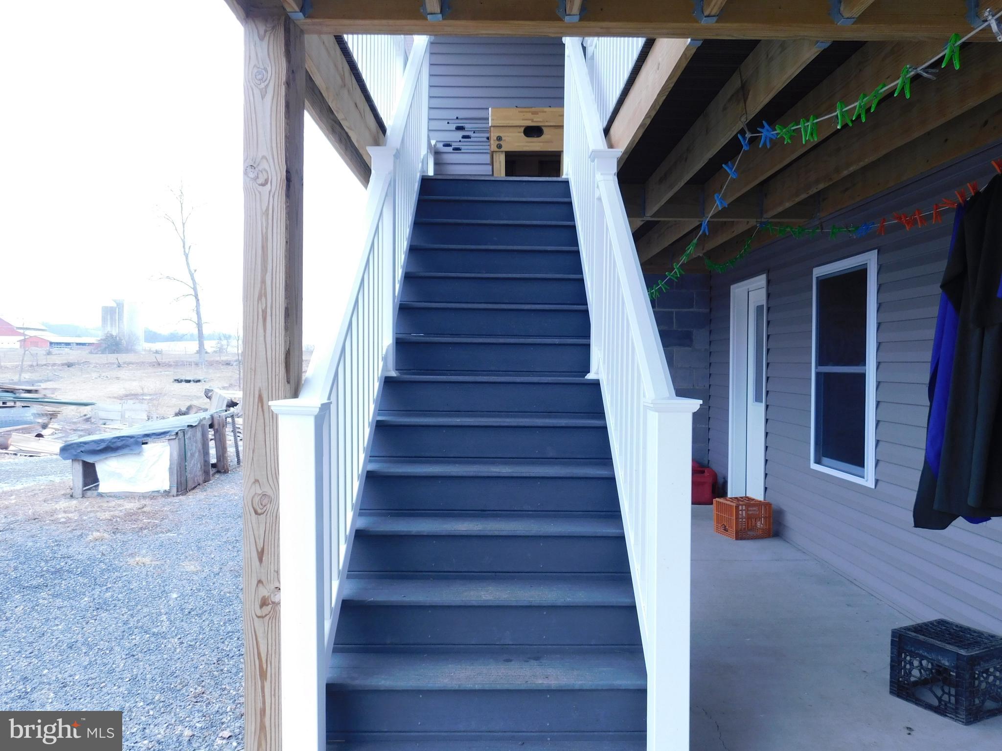 171 Gaul Road Port Royal, PA 17082 - Photo 28 of 46 a view of staircase with lots of frames on wall and windows