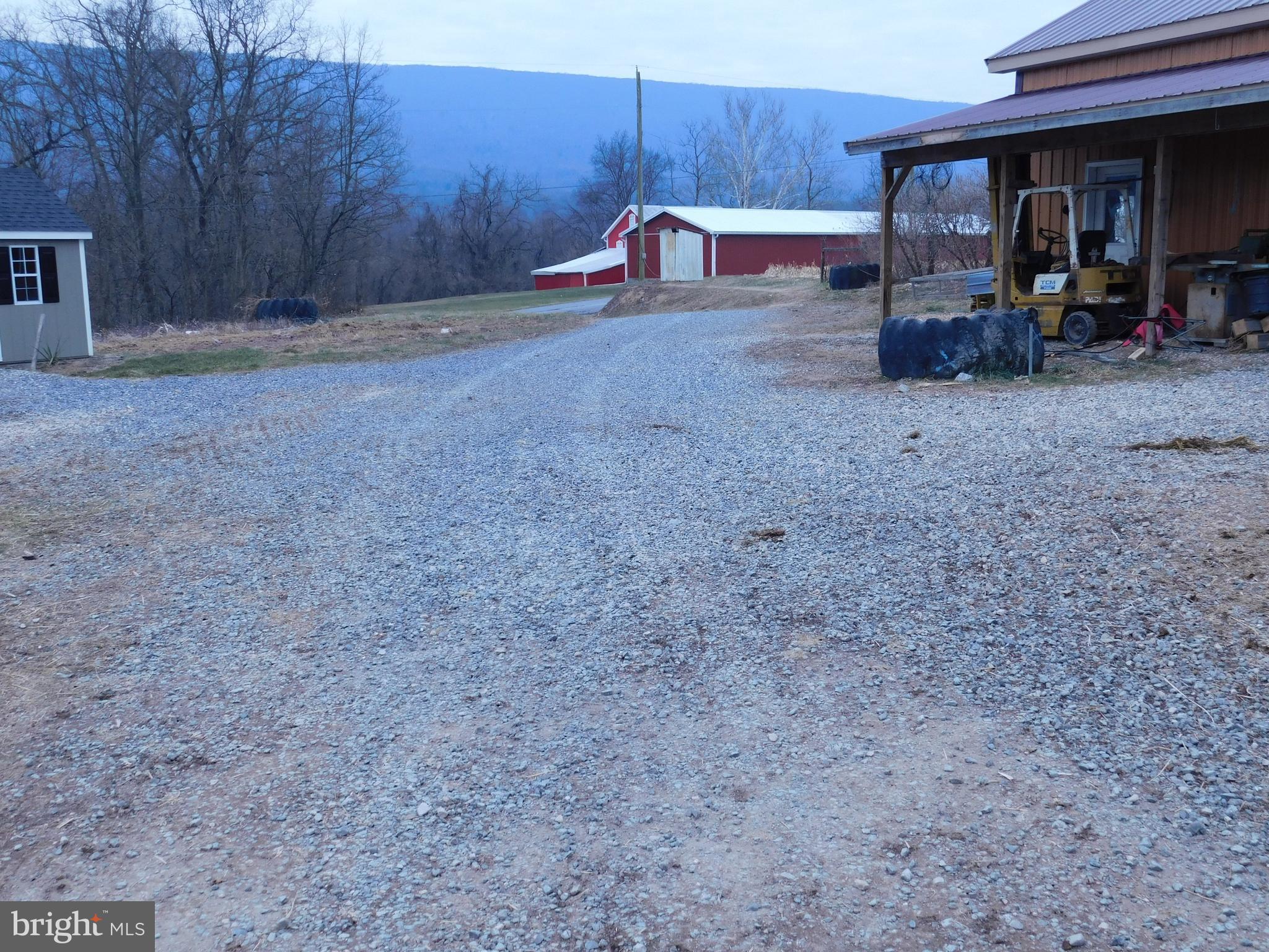 171 Gaul Road Port Royal, PA 17082 - Photo 39 of 46 a backyard of a house with barbeque oven table and chairs