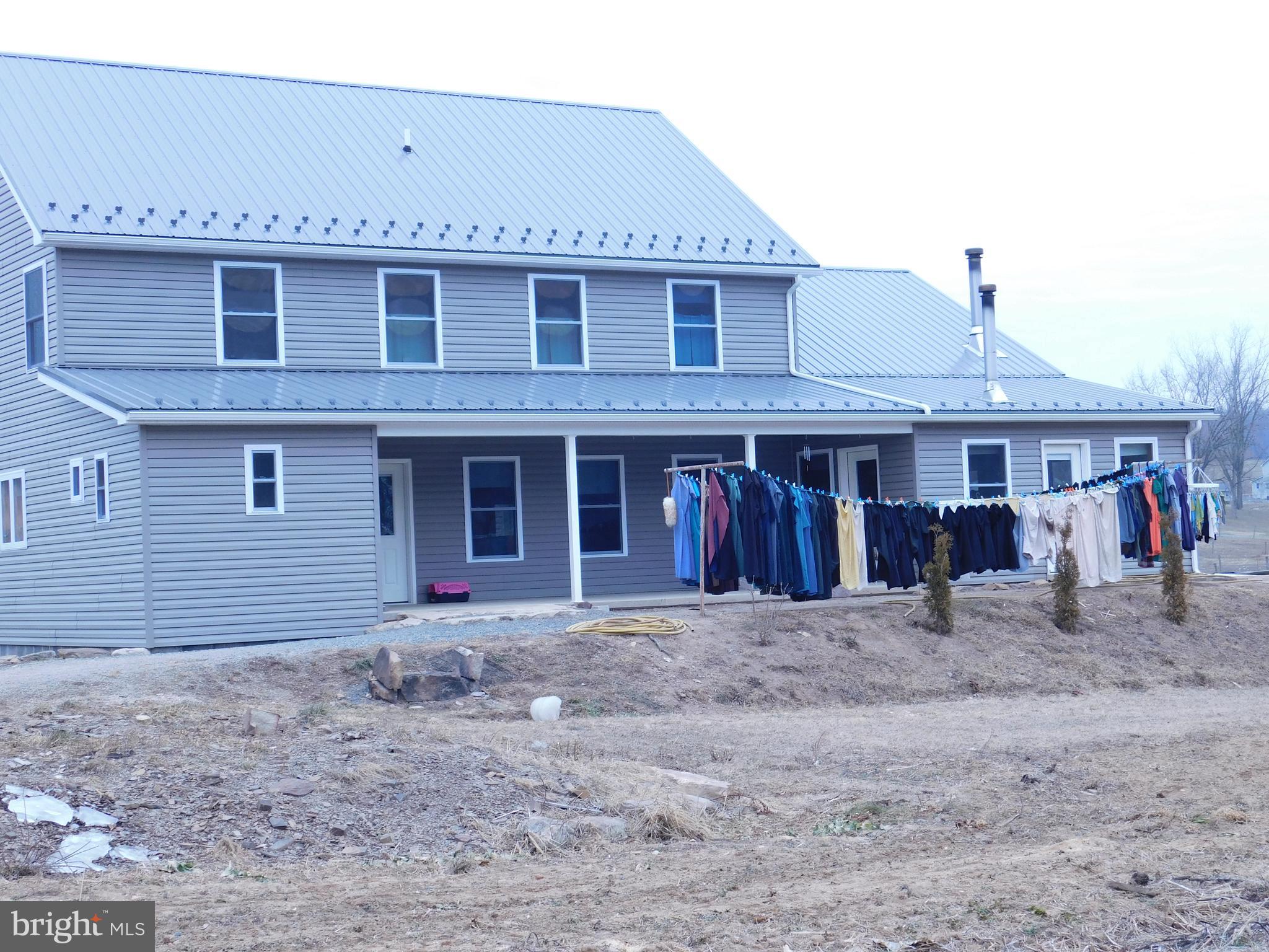 171 Gaul Road Port Royal, PA 17082 - Photo 40 of 46 a front view of a house with a yard and seating space