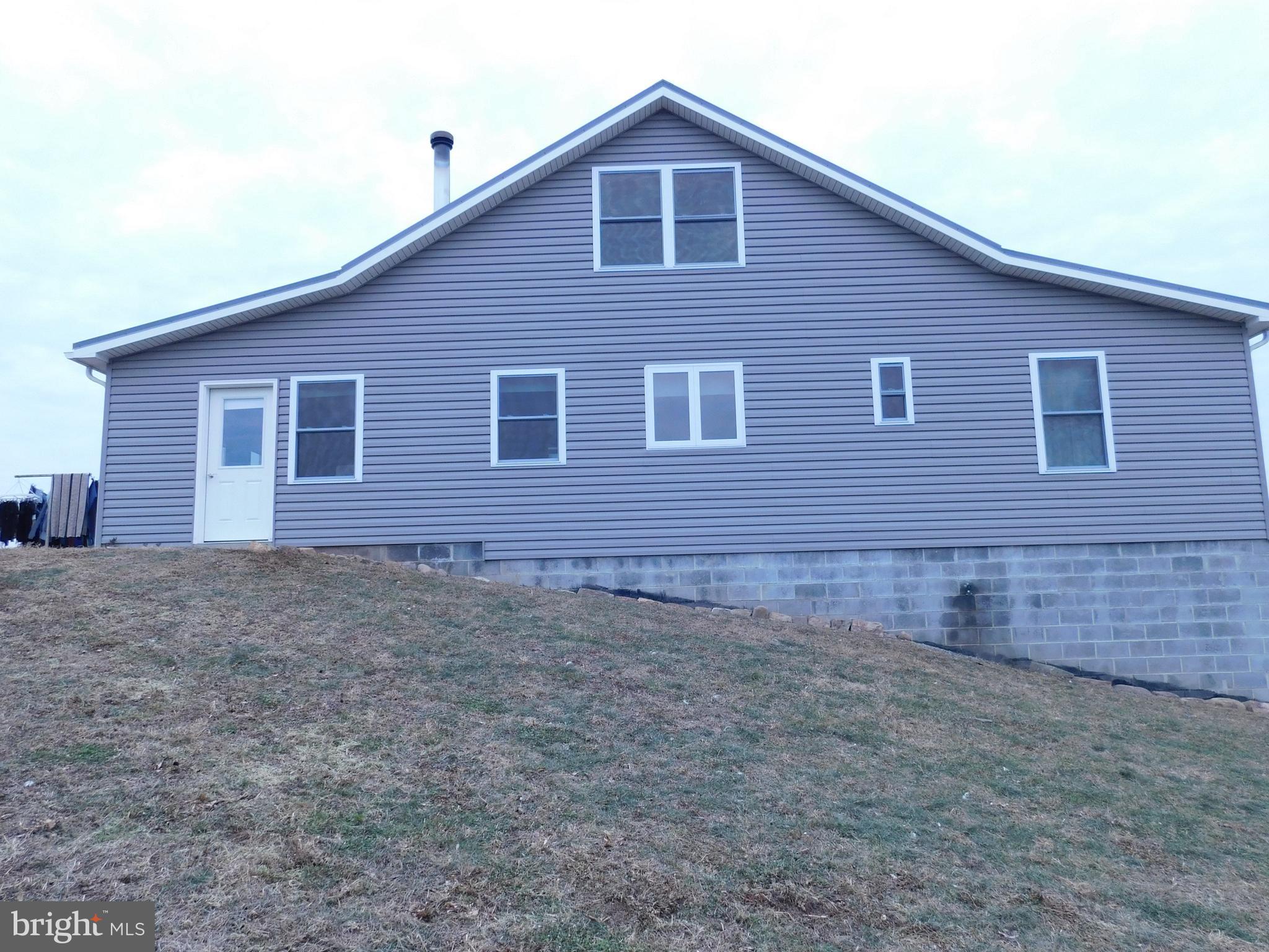 171 Gaul Road Port Royal, PA 17082 - Photo 43 of 46 a brick house that has a small yard and parking space