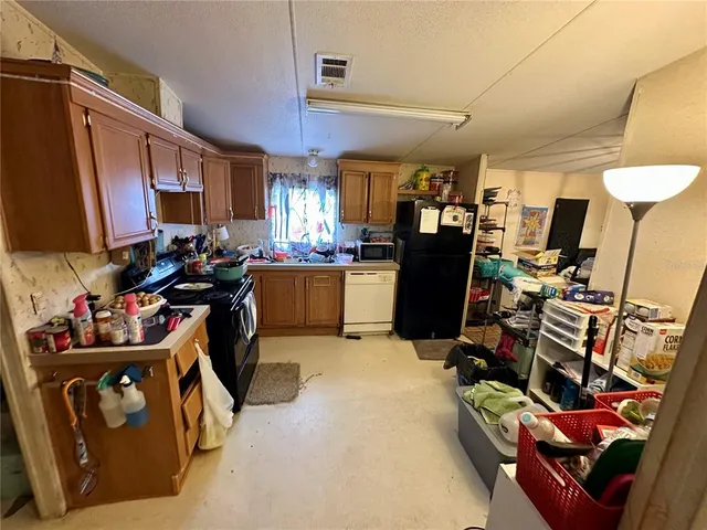 a bed room with a bed and a chair