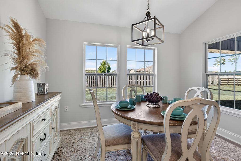 55225 Bartram Trail Callahan, FL 32011 - Photo 26 of 69 a view of a dining room with furniture window and outside view