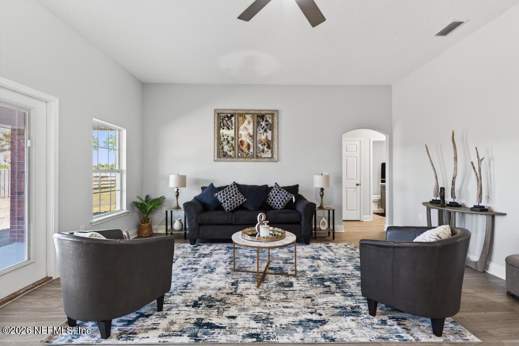 55225 Bartram Trail Callahan, FL 32011 - Photo 28 of 69 a living room with furniture a window and a potted plant