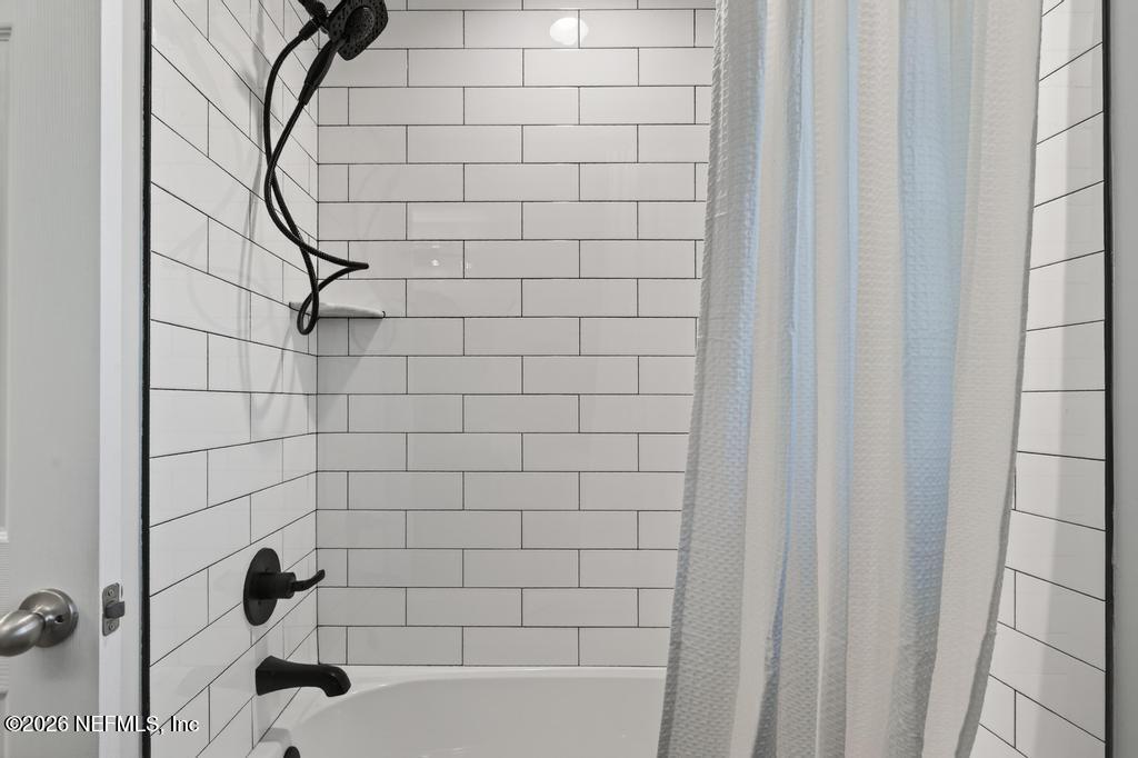 55225 Bartram Trail Callahan, FL 32011 - Photo 36 of 69 a bathroom with a bathtub