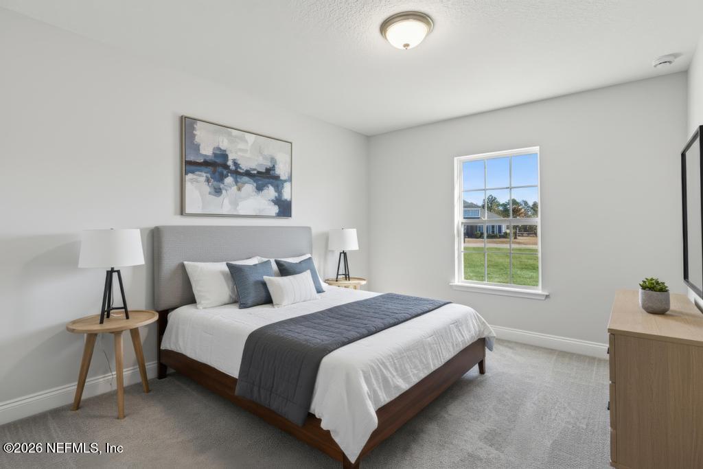 55225 Bartram Trail Callahan, FL 32011 - Photo 39 of 69 a bedroom with a bed and a window