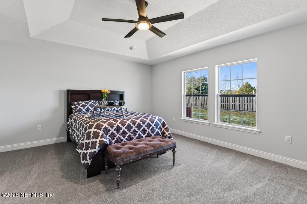 55225 Bartram Trail Callahan, FL 32011 - Photo 42 of 69 a bedroom with a bed and window