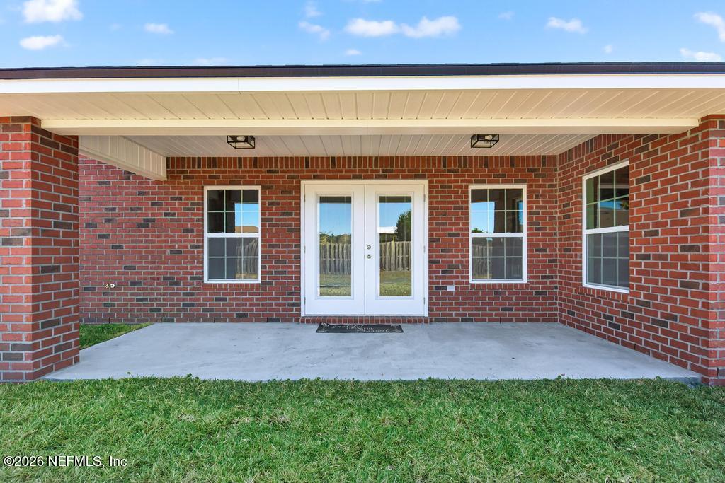 55225 Bartram Trail Callahan, FL 32011 - Photo 57 of 69 a front view of a house with a yard