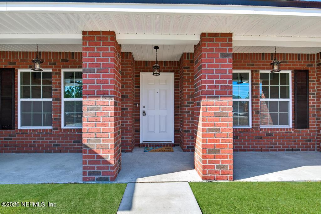 55225 Bartram Trail Callahan, FL 32011 - Photo 6 of 69 a front view of a house with a yard