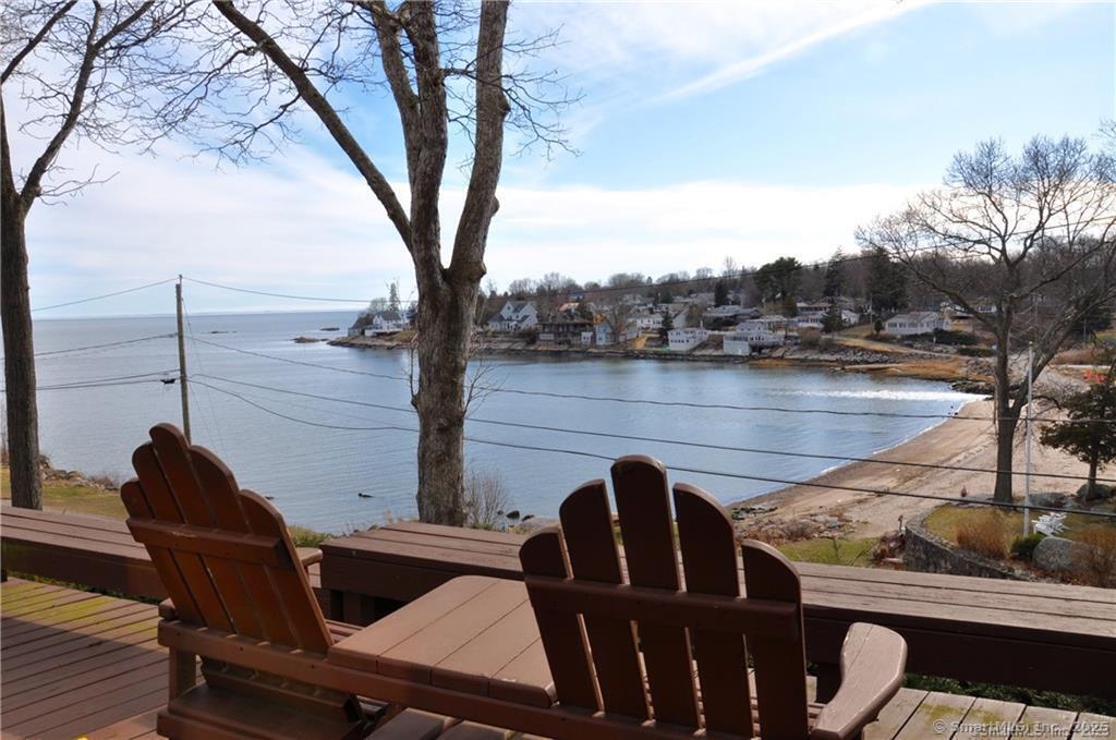 92 High Ridge Road, Unit JUNE 2026 2 Guilford, CT 06437 - Photo 16 of 33 a view of a chairs and table in patio with lake view