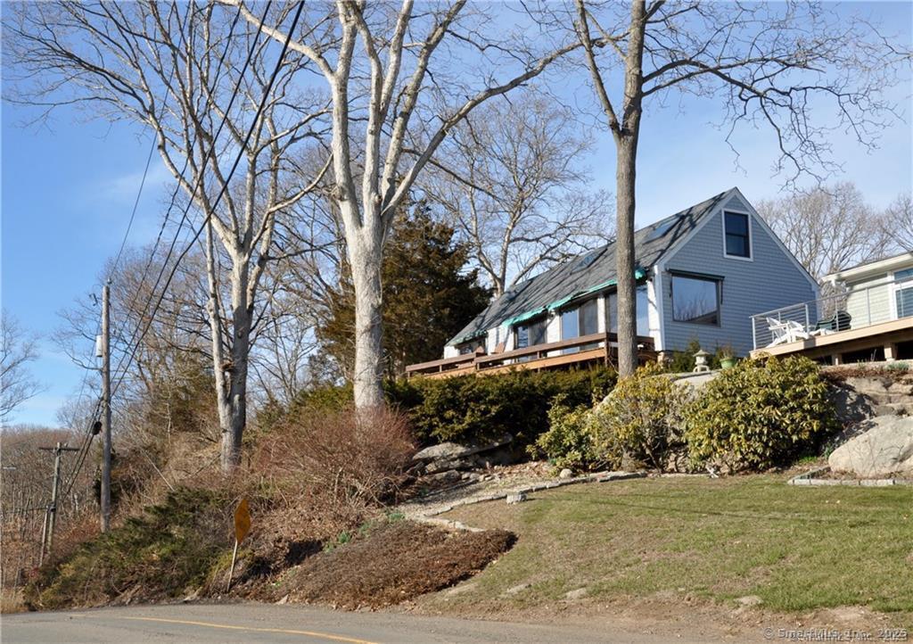 92 High Ridge Road, Unit JUNE 2026 2 Guilford, CT 06437 - Photo 2 of 33 a front view of a house with a yard covered with snow